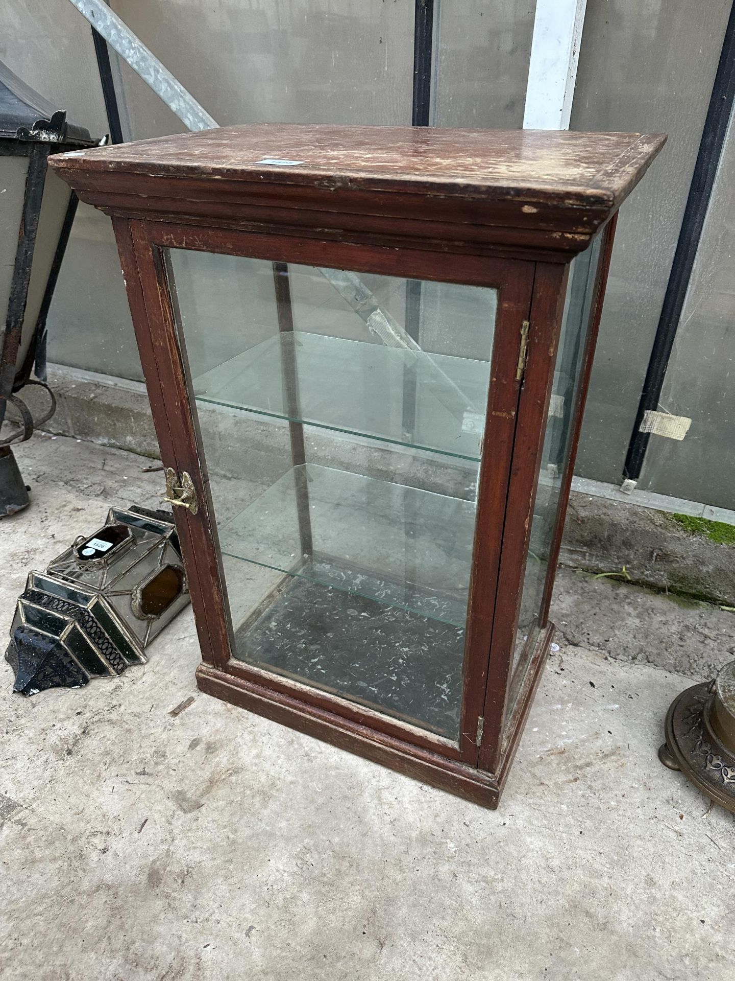 AN EARLY 20TH CENTURY OAK AND GLASS SHOP DISPLAY CABINET