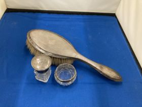 THREE HALLMARKED SILVER ITEMS TO INCLUDE A BIRMINGHAM HAIR BRUSH, A BIRMINGHAM LIDDED GLASS BOTTLE