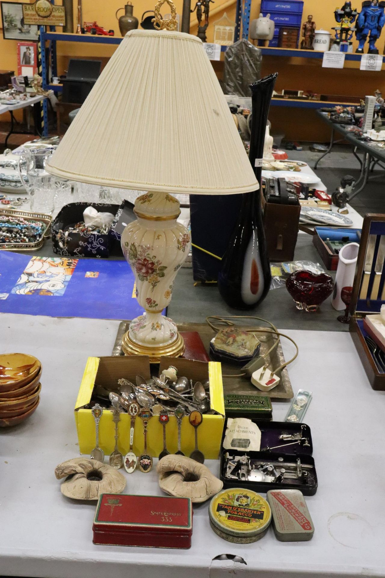 A LARGE MIXED LOT TO INCLUDE A CERAMIC TABLE LAMP AND SHADE, LARGE QUANTITY OF SOUVENIR TEASPOONS,