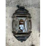 A VINTAGE AND DECORATIVE GLASS WALL LANTERN