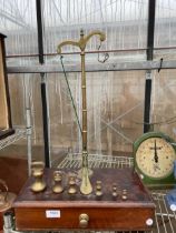 A SET OF VINTAGE BRASS SCALES WITH LOWER MAHOGANY DRAWER AND BRASS BELL WEIGHTS