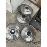 FOUR VINTAGE ALUMINIUM WHEEL COVERS