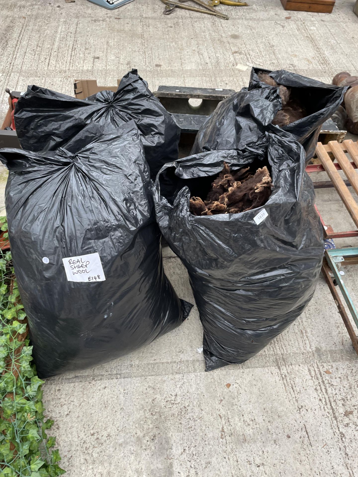 FOUR LARGE BAGS OF SHEEPS WOOL FOR SPINNING