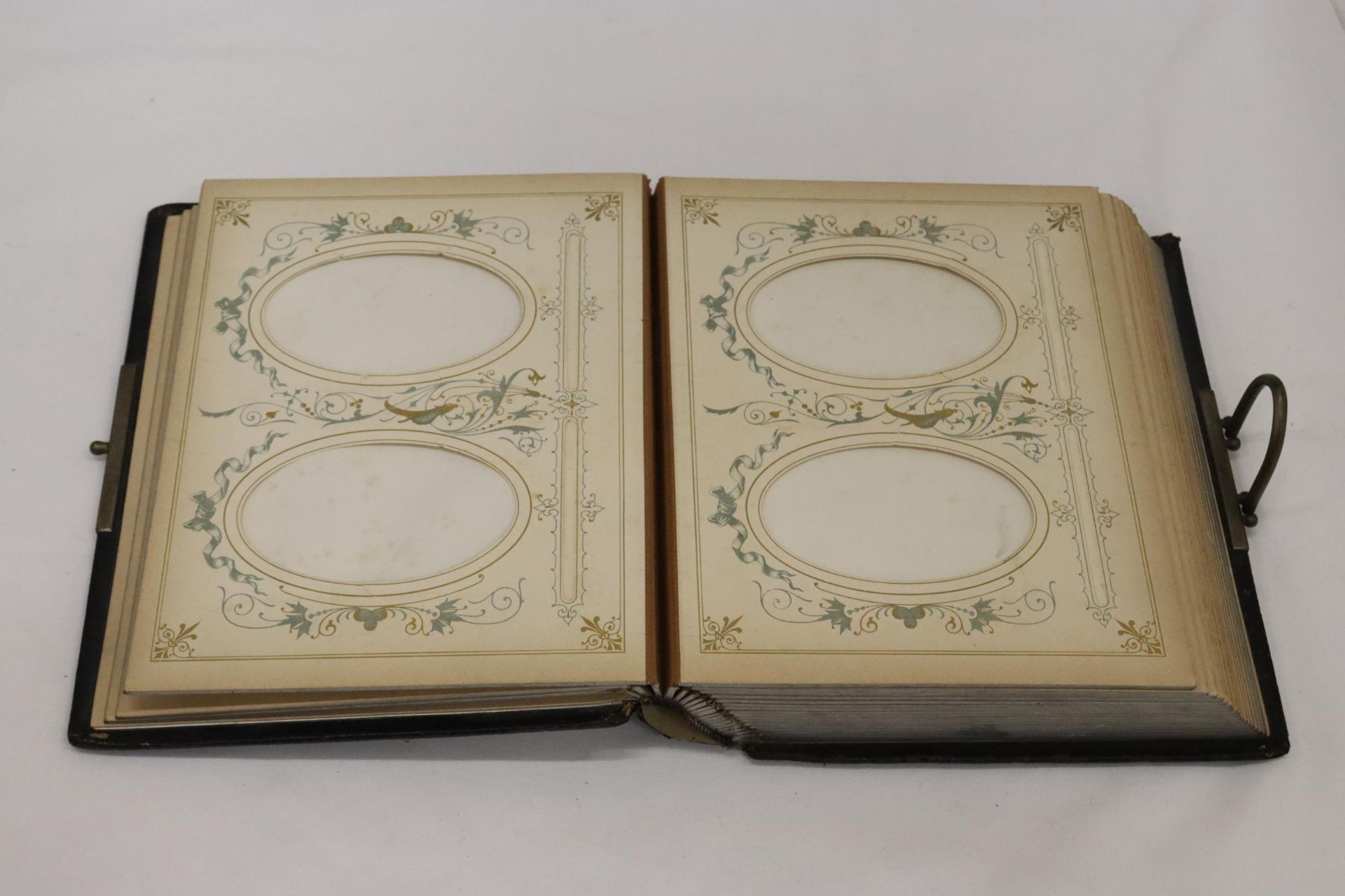 A VICTORIAN LEATHER BOUND PHOTO ALBUM WITH A WHITE METAL SHIELD SHAPED CARTOUCHE TO THE FRONT COVER - Image 3 of 6