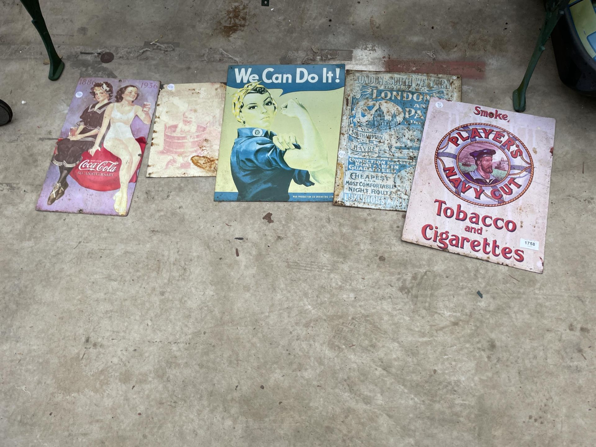 AN ASSORTMENT OF TIN SIGNS