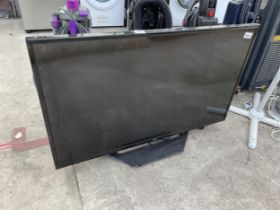 AN LG 43" TELEVISION WITH REMOTE CONTROL