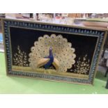 A LARGE GILT FRAMED EMBROIDERED COLLAGE OF A PEACOCK
