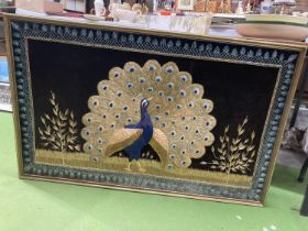 A LARGE GILT FRAMED EMBROIDERED COLLAGE OF A PEACOCK