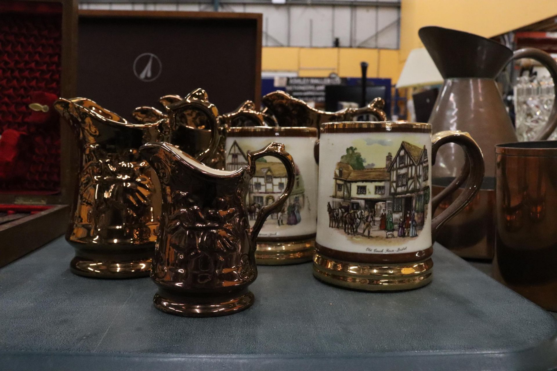 FIVE VINTAGE BRONZE LUSTRE WARE JUGS TOGETHER WITH THREE ARTHUR WOOD TANKARDS WITH COACHING SCENES - Image 2 of 7