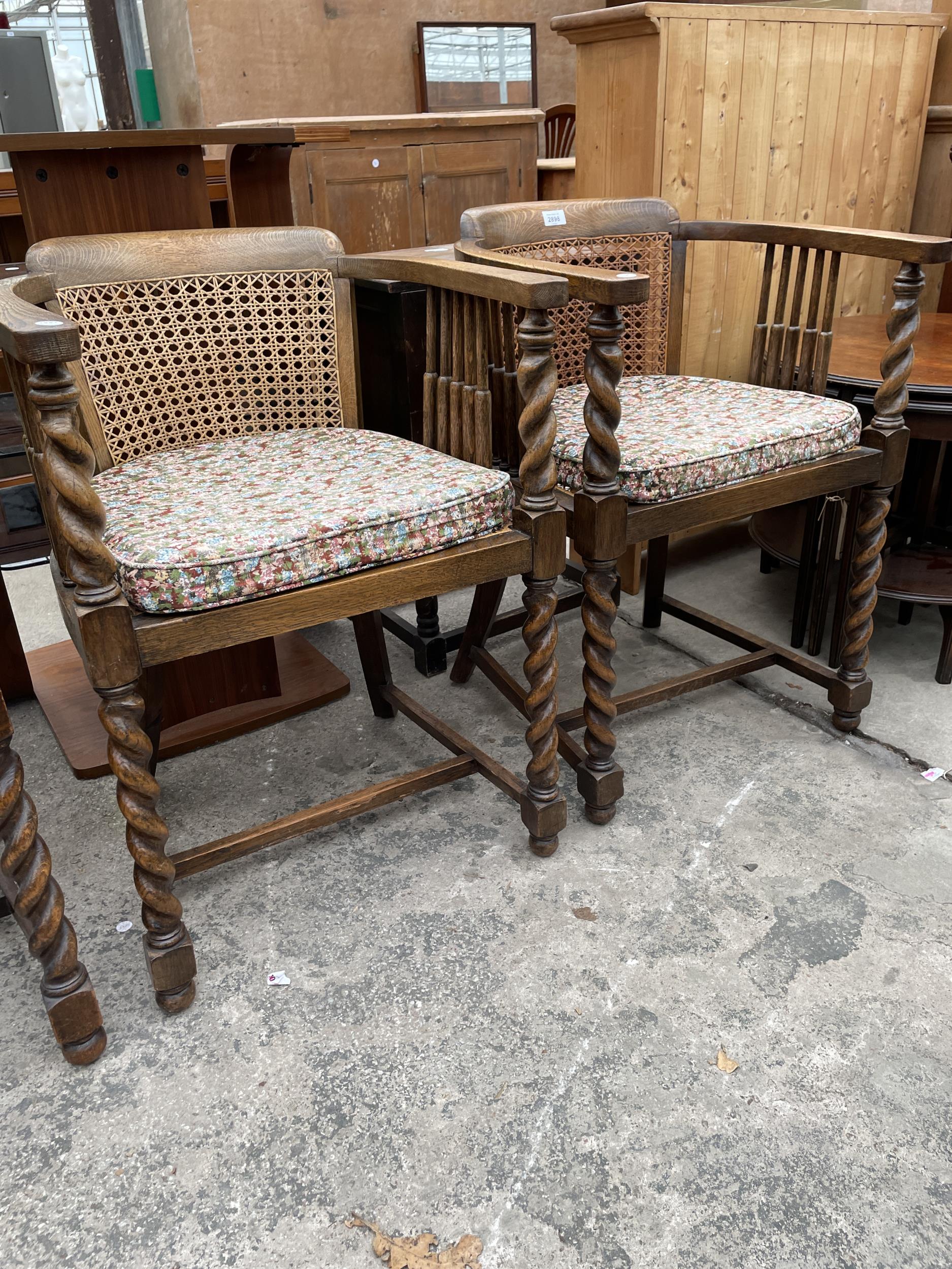 A PAIR OF EARLY 20TH CENTURY OAK TUB CHAIRS WITH CANE SEATS AND BACKS ON BARLEY TWIST LEGS AND - Image 2 of 4