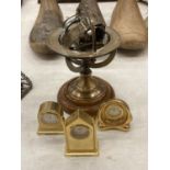 THREE MINIATURE BRASS CLOCKS, HEIGHT APPROX 6CM, PLUS A SMALL ARMILLARY SPHERE ON A WOODEN BASE,