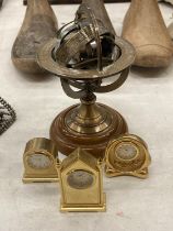 THREE MINIATURE BRASS CLOCKS, HEIGHT APPROX 6CM, PLUS A SMALL ARMILLARY SPHERE ON A WOODEN BASE,