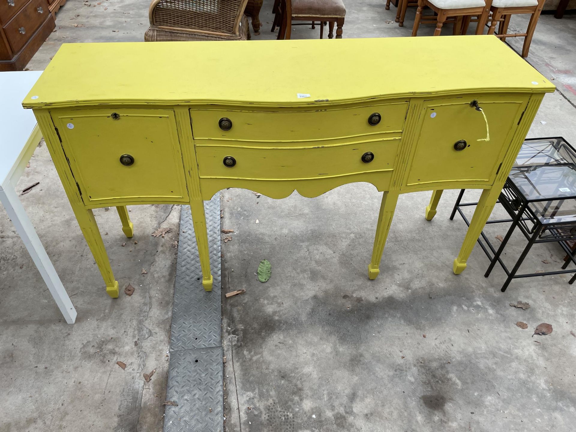 A REGENCY STYLE YELLOW PAINTED SIDEBOARD, 63" WIDE