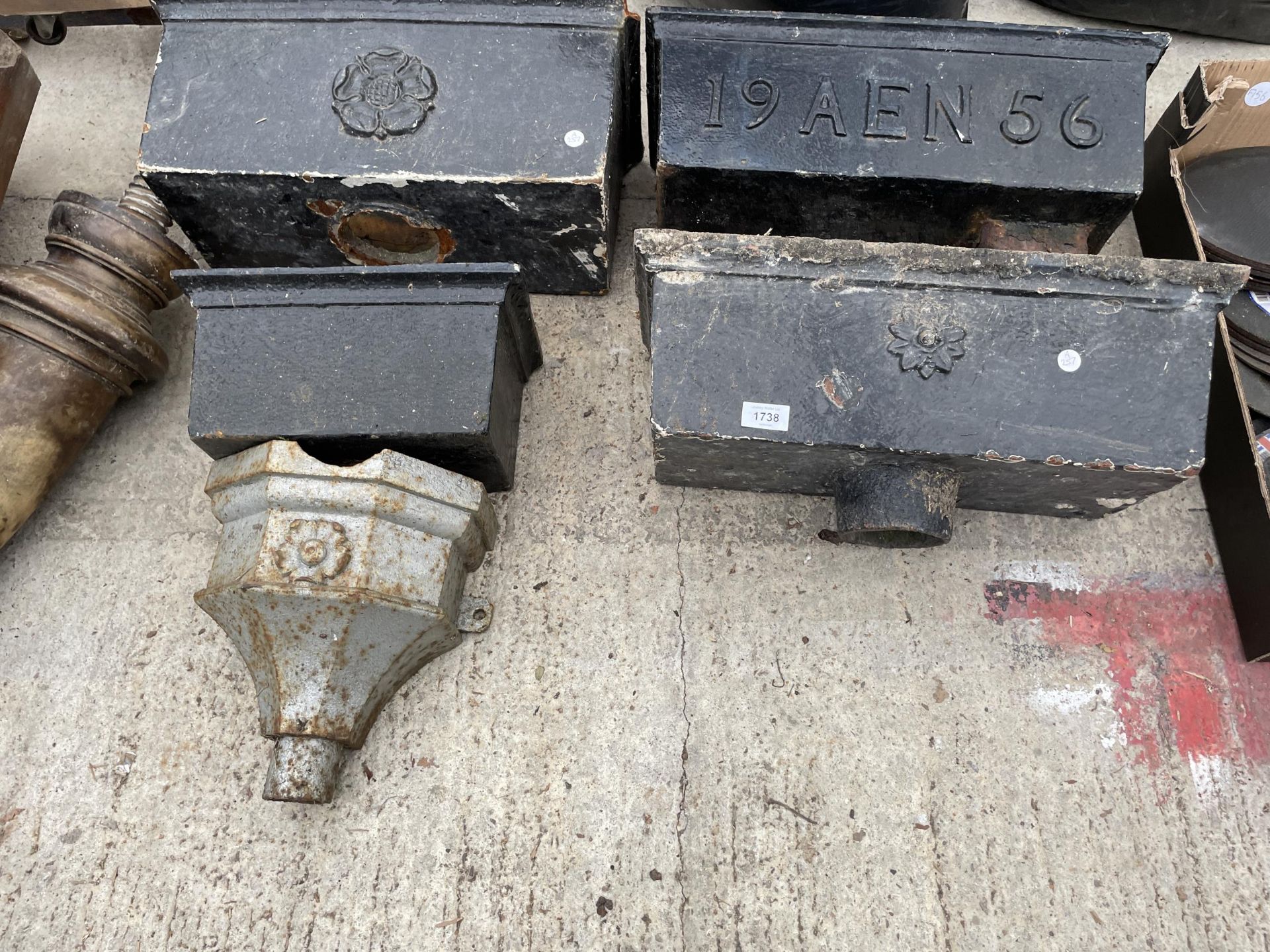 AN ASSORTMENT OF DECORATIVE VINTAGE CAST IRON GUTTER HOPPERS