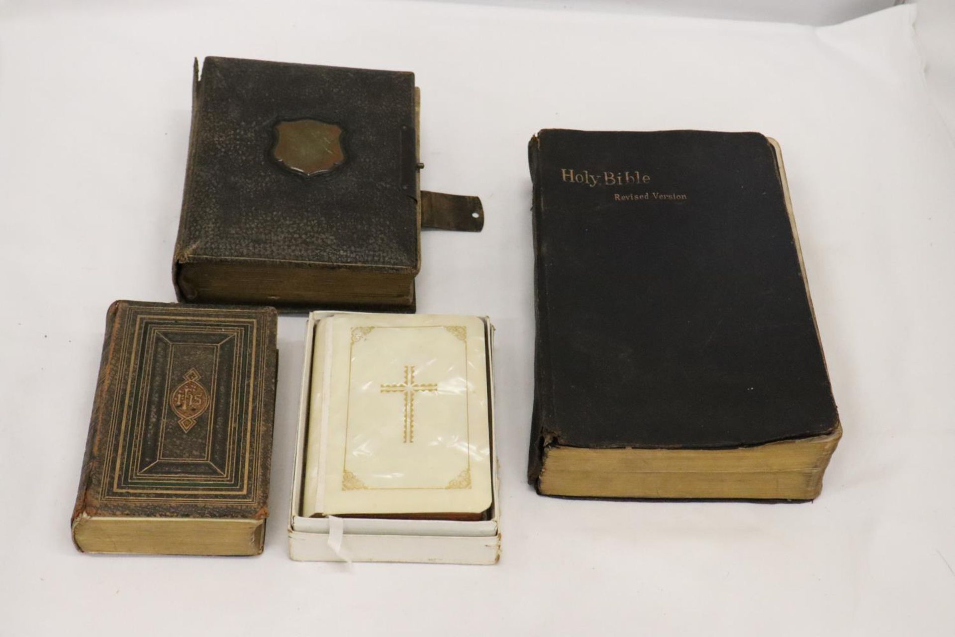 THREE VINTAGE POCKET BIBLES AND A CHURCH BIBLE