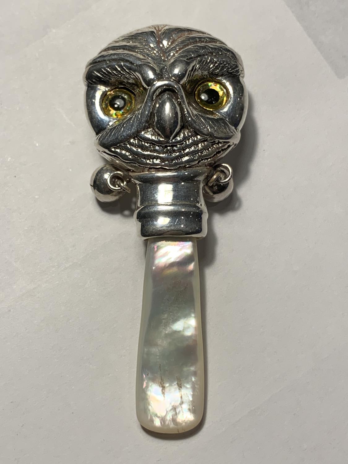 A SILVER AND MOTHER OF PEARL OWL BABY RATTLE