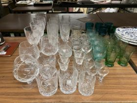A LARGE QUANTITY OF GLASSES TO INCLUDE WINE, CHAMPAGNE FLUTES, SHERRY,BRANDY, ETC