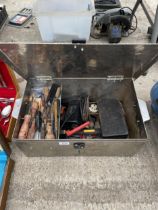 A METAL TOOL CHEST WITH AN ASSORTMENT OF TOOLS TO INCLUDE AN ELECTRIC JIGSAW AND CHISELS ETC