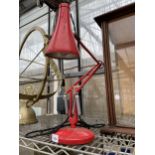 A VINTAGE RED ANGLE POISE LAMP