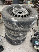 A SET OF FOUR PIRELLI 235/65R16 TYRES WITH RIMS, BELIEVED TO BE OFF A MERCEDES BENZ