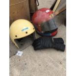 TWO MOTORBIKE HELMETS AND A GLOVE