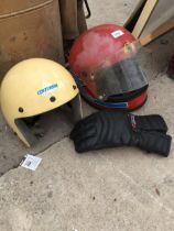 TWO MOTORBIKE HELMETS AND A GLOVE