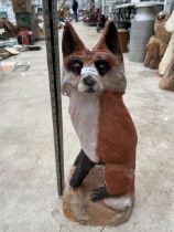 A CHAINSAW CARVED SITTING FOX (H:65CM)