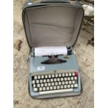 A RETRO BROTHER DELUXE TYPE WRITER WITH CARRY CASE