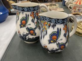 TWO VINTAGE LOSOL WARE JUGS IN THE 'PAPILLON' PATTERN, HEIGHTS 17CM AND 15CM