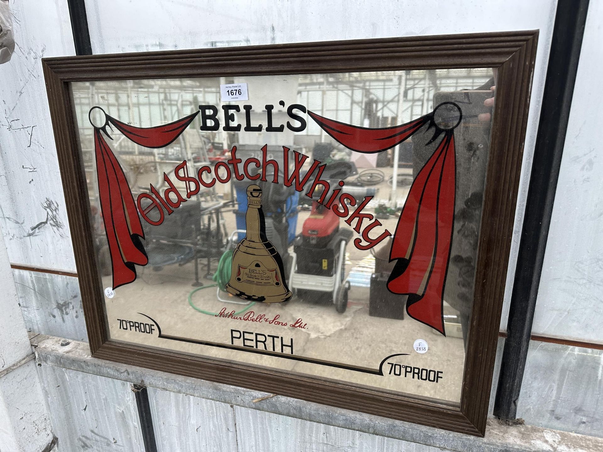 A VINTAGE STYLE BELLS WHISKEY ADVERTISING MIRROR