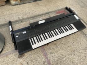 A YAMAHA PSR-60 ELECTRIC KEYBOARD WITH STAND