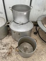 THREE LARGE ALUMINIUM COOKING POTS, ONE COMPLETE WITH LID