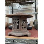 A VINTAGE CAST IRON ORIENTAL GARDEN PERGODA CANDLE LANTERN