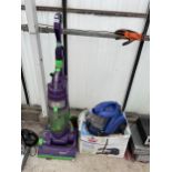 A DYSON DC04 VACUUM CLEANER AND A BISSELL COMPACT VACUUM CLEANER