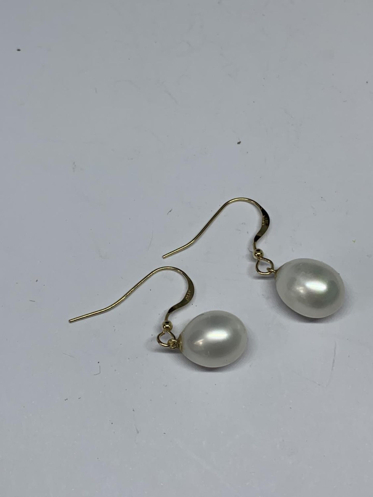 A PAIR OF 14 CARAT GOLD AND PEARL EARRINGS GROSS WEIGHT 3.62 GRAMS