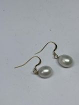 A PAIR OF 14 CARAT GOLD AND PEARL EARRINGS GROSS WEIGHT 3.62 GRAMS