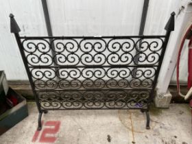 A DECORATIVE WROUGHT IRON FIRE SCREEN