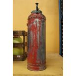 A VINTAGE FIRE EXTINGUISHER WITH BRASS PLUNGER