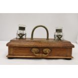A VINTAGE OAK DESKSET WITH BRASS HANDLE AND DRAWER WITH GLASS INKWELLS