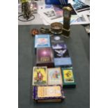 A QUANTITY OF TAROT AND ORACLE CARDS, PLUS AN ACCURIST WRISTWATCH, MINI GRANDFATHER MANTLE CLOCK,