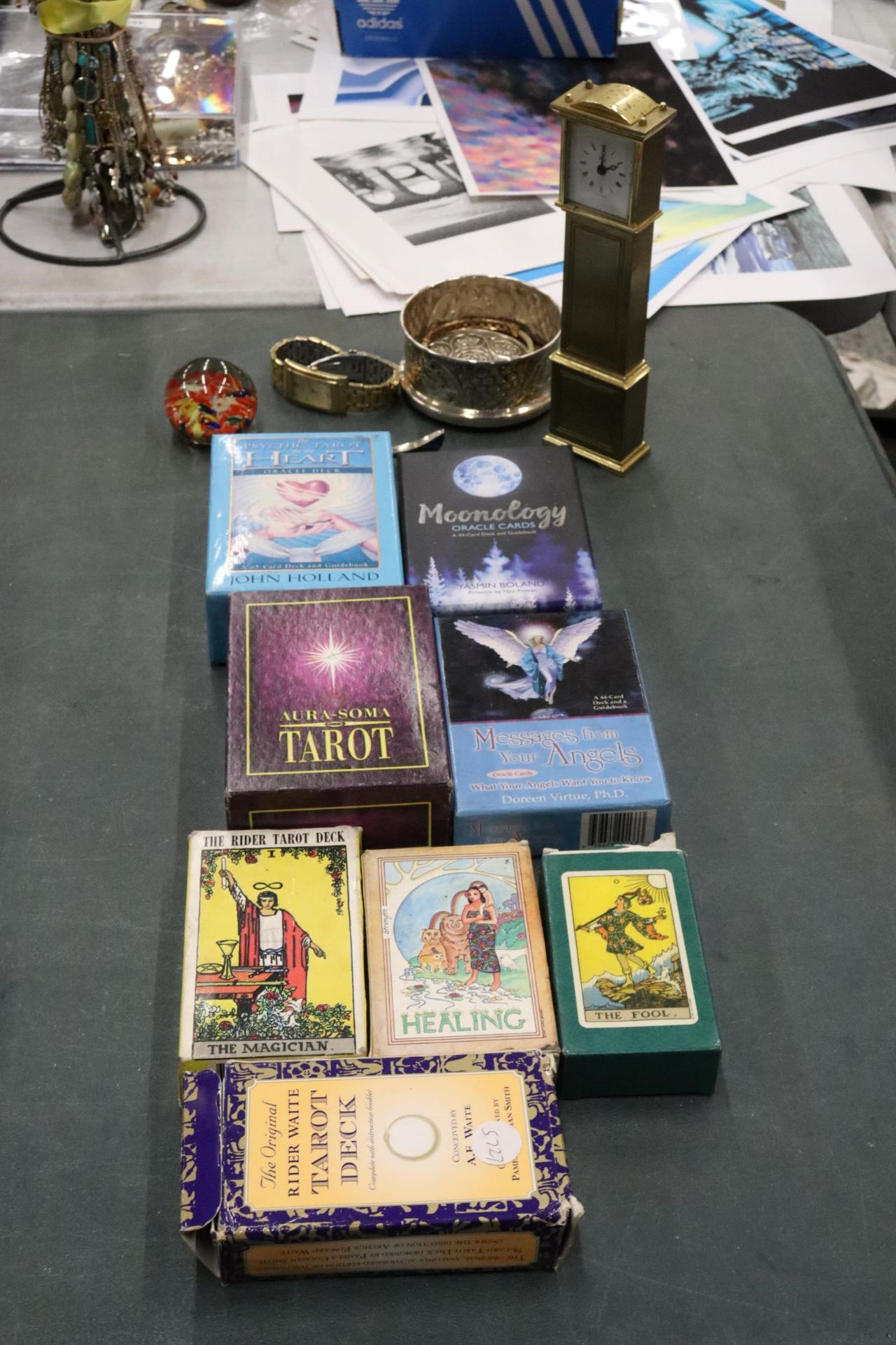 A QUANTITY OF TAROT AND ORACLE CARDS, PLUS AN ACCURIST WRISTWATCH, MINI GRANDFATHER MANTLE CLOCK,