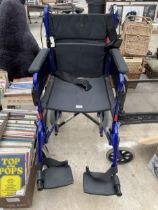 AN INVACARE ALU LITE WHEEL CHAIR