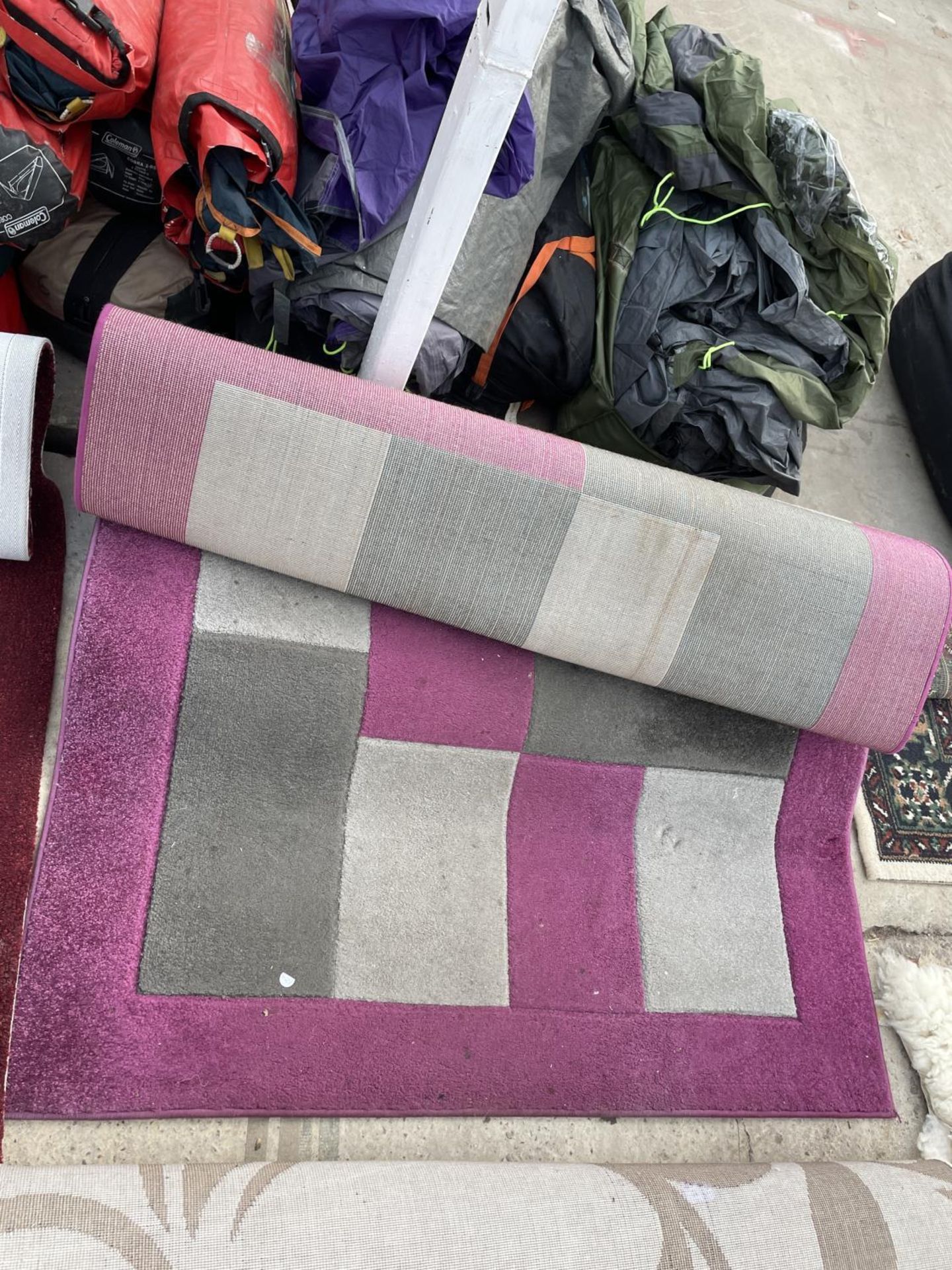 A MODERN PURPLE RUG