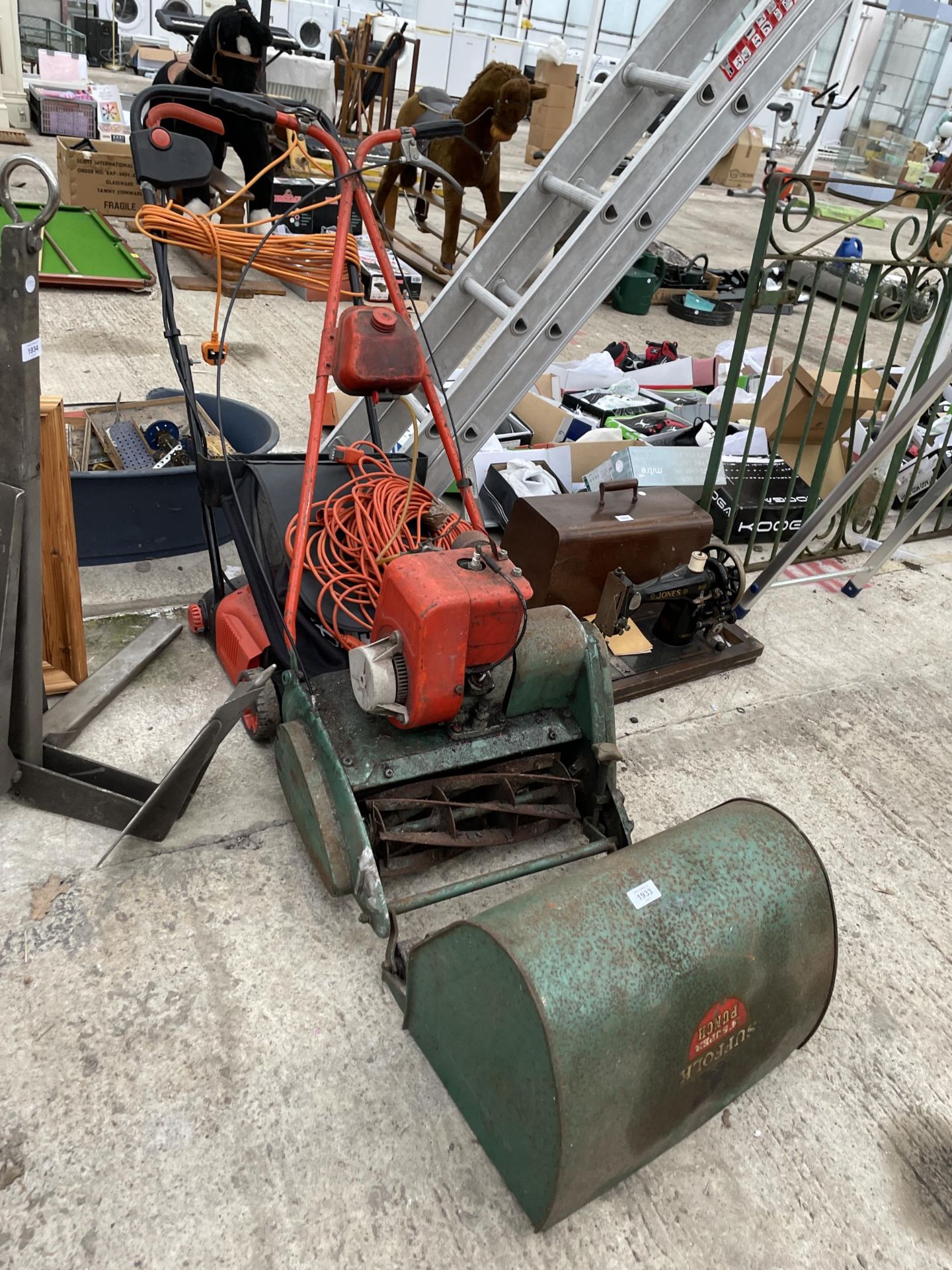 AN ELECTRIC BLACK AND DECKER LAWN MOWER AND A SUFFOLK PUNCH ROTARY LAWN MOWER