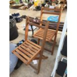 TWO TEAK FOLDING GARDEN CHAIRS