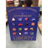 A SAMPLE CARD OF 'GATTOPAVONE' FOR LIBERTY NOVELTY CUFFLINKS