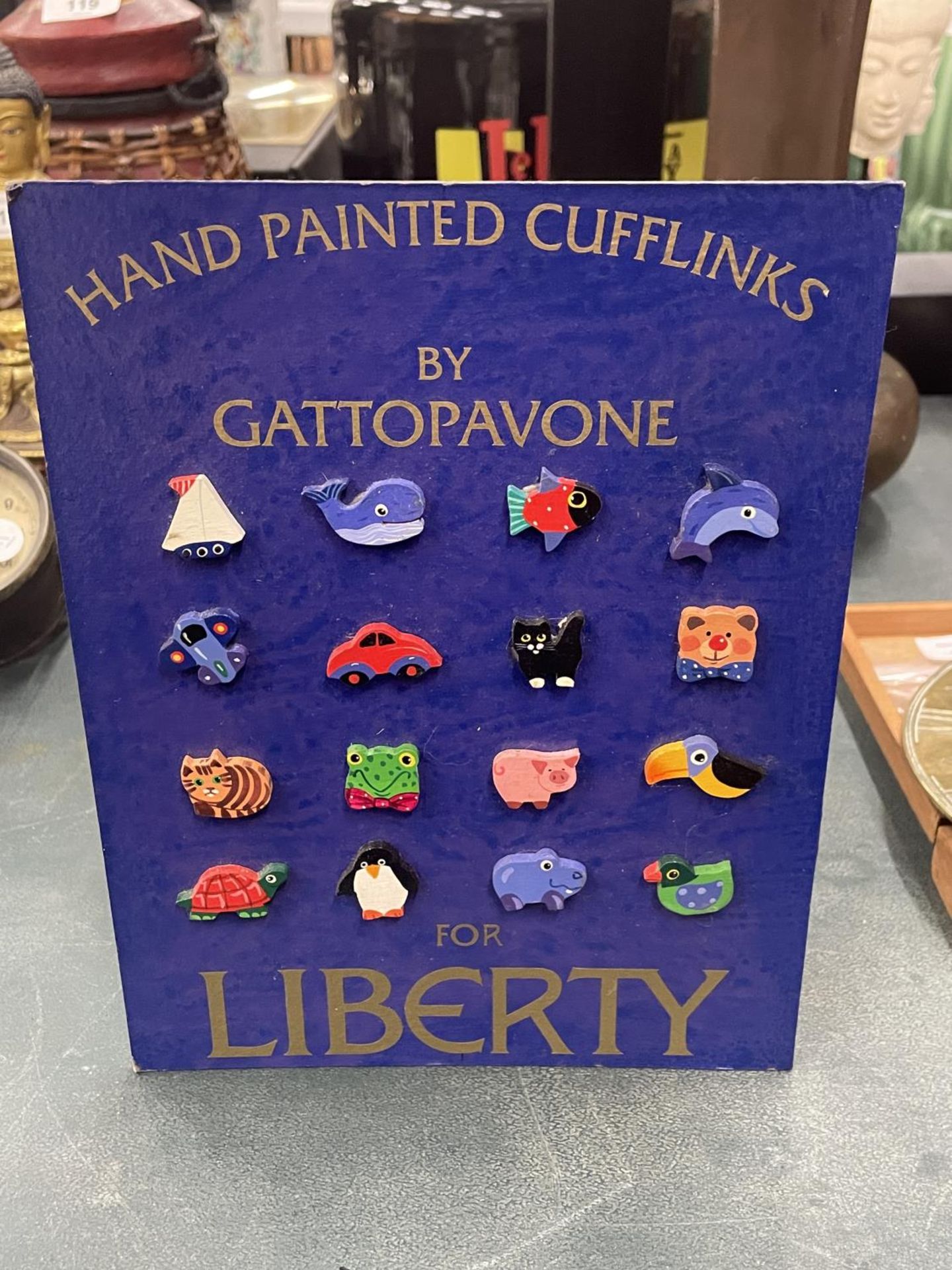 A SAMPLE CARD OF 'GATTOPAVONE' FOR LIBERTY NOVELTY CUFFLINKS