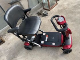 A GENIE MOBILITY SCOOTER WITH AUTOMATED FOLDING MECHANISM COMPLETE WITH KEY AND CHARGER