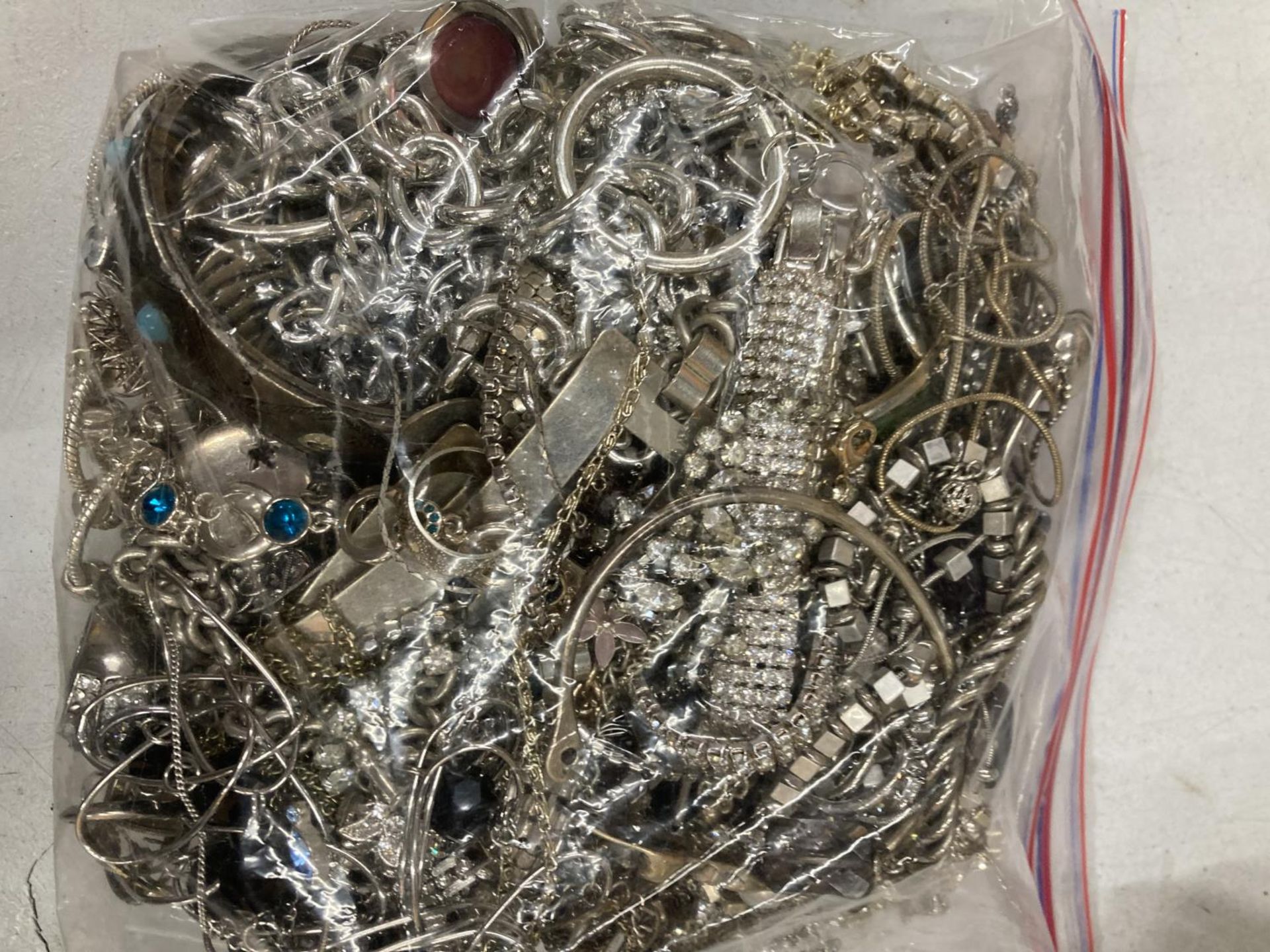 A LARGE QUANTITY OF WHITE METAL JEWELLERY