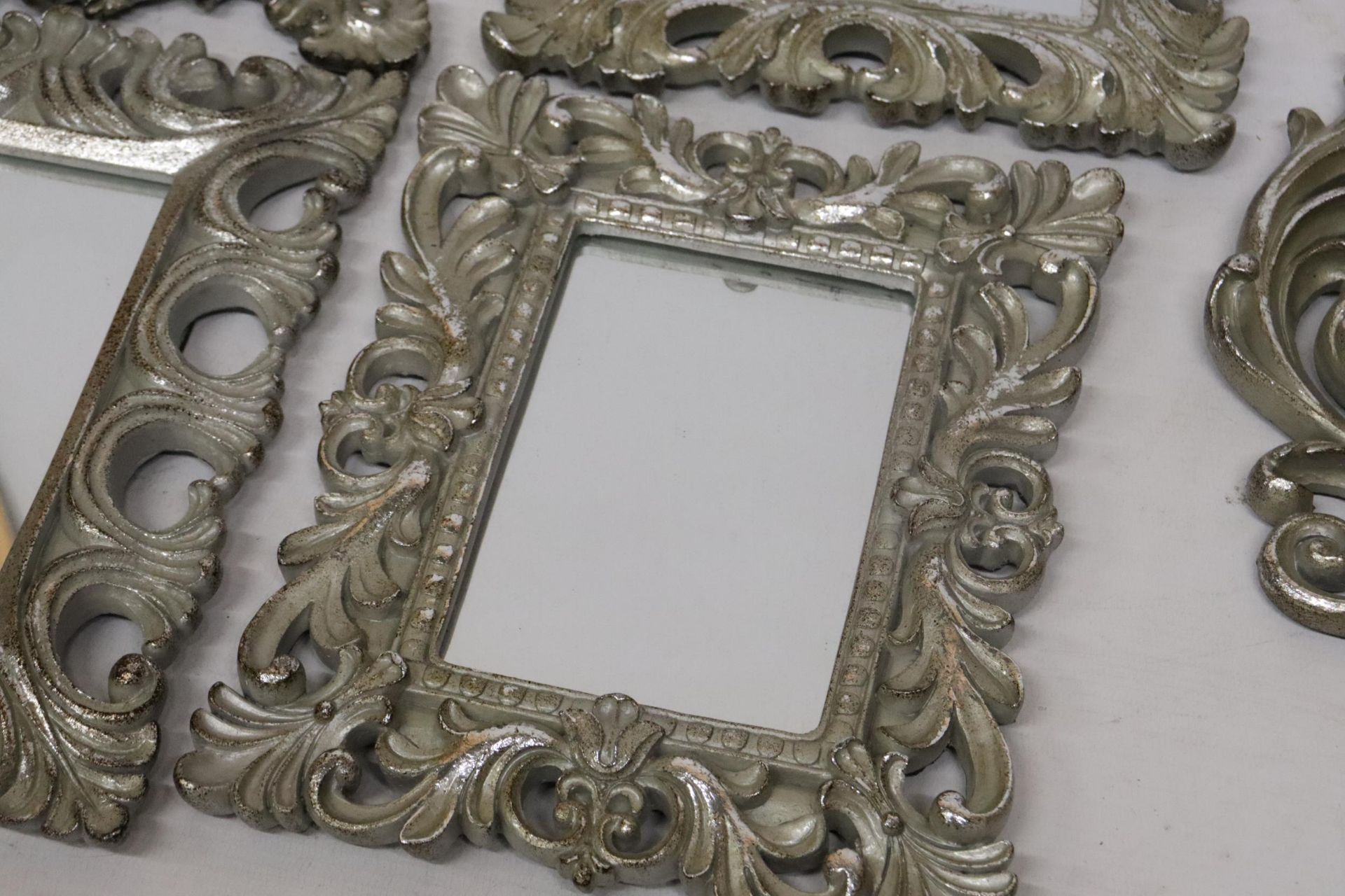 FIVE SMALL MIRRORS WITH ORNATE SILVER COLOURED FRAMES - Image 8 of 9